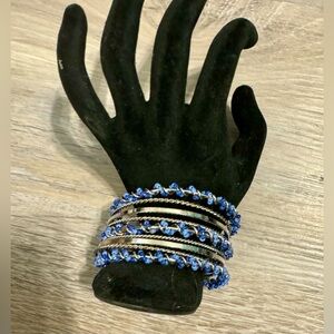 Women's metal bracelet with blue beads. Adjustable size. New never used.